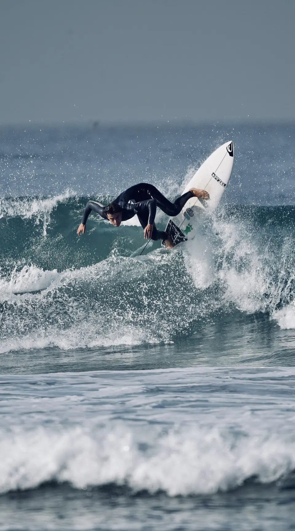 Green-blue wave curling for an ocean-level surf photo