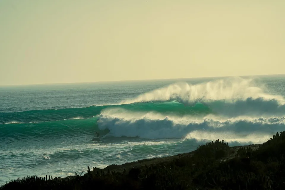 Surfer riding a wave off the Moroccan coast