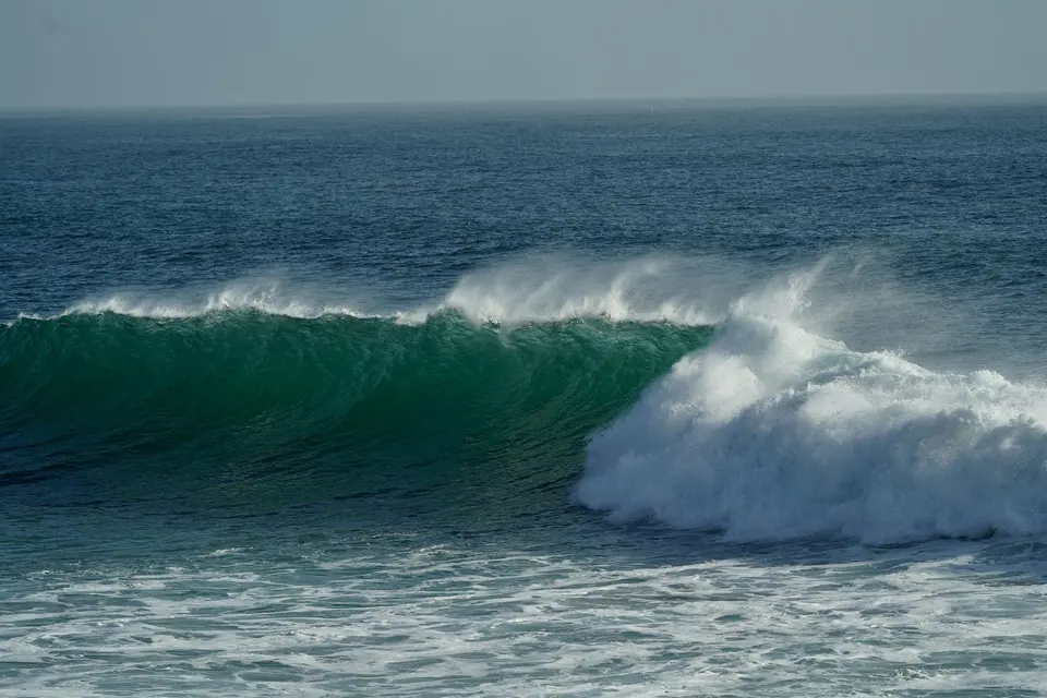 Surfer inside a turquoise barrel