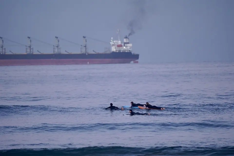 Surfer turning on a powerful blue wave
